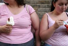 At Least 1 in 3 Americans Aged 18 to 25 Are Obese, Finds Study 2 overweight women eating icecream